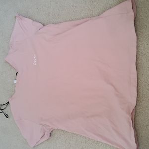 Is a light pink T-shirt